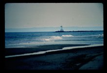 Jetty_at_Breezy_Point_Sandy_Hook_in_the_bacground.jpg